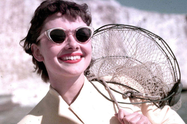 Audrey Hepburn wearing Cat eye frames